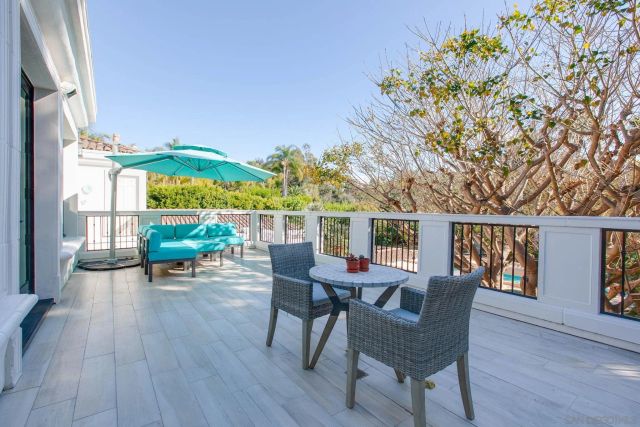 a spacious bathroom with a tub sink and mirror