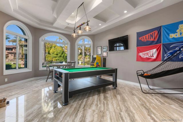 a large white kitchen with a large window