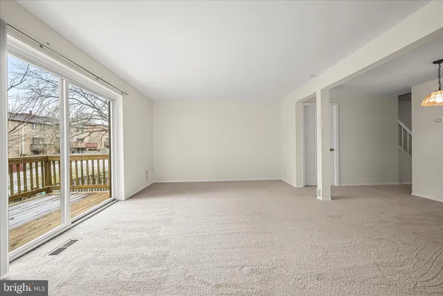 a balcony with wooden floor and fence