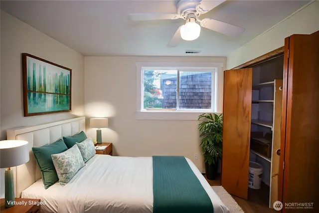 a bedroom with bed and a window