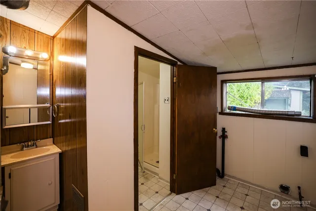 a bathroom with a sink and a mirror