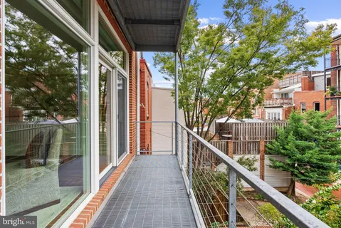 a bedroom with a bed and a fireplace