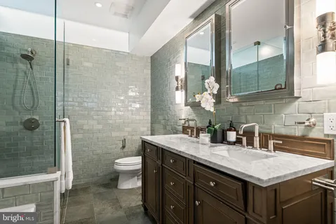 a bedroom with a large bed and a large window