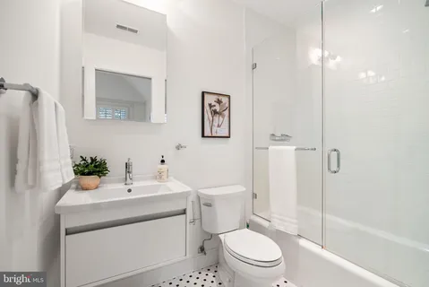 a utility room with cabinets washer and dryer
