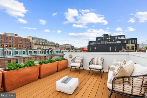 a terrace of a house with outdoor seating