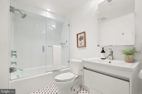 a view of a wooden deck with table and chairs