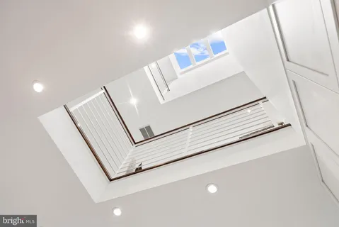 a view of a dining room with furniture large windows and wooden floor