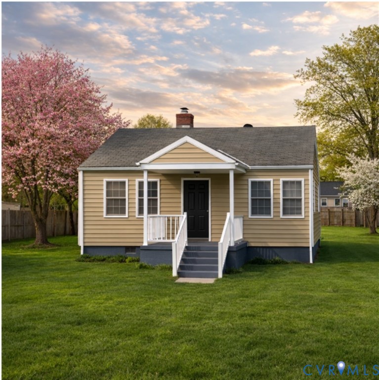5732 Spruance Road Richmond, VA 23225 - Photo 1 of 1 a front view of a house with a garden