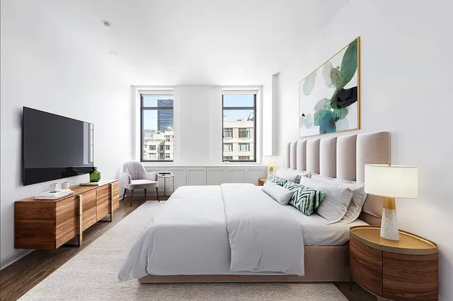 a spacious bathroom with a double vanity sink a mirror and a bathtub