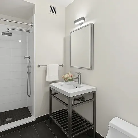 a bedroom with bed and flat screen tv