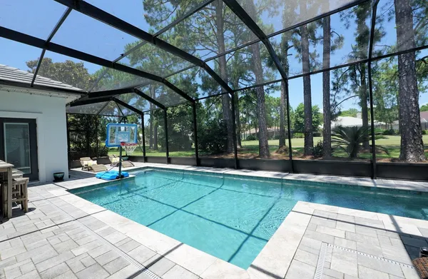 a view of a swimming pool with a patio