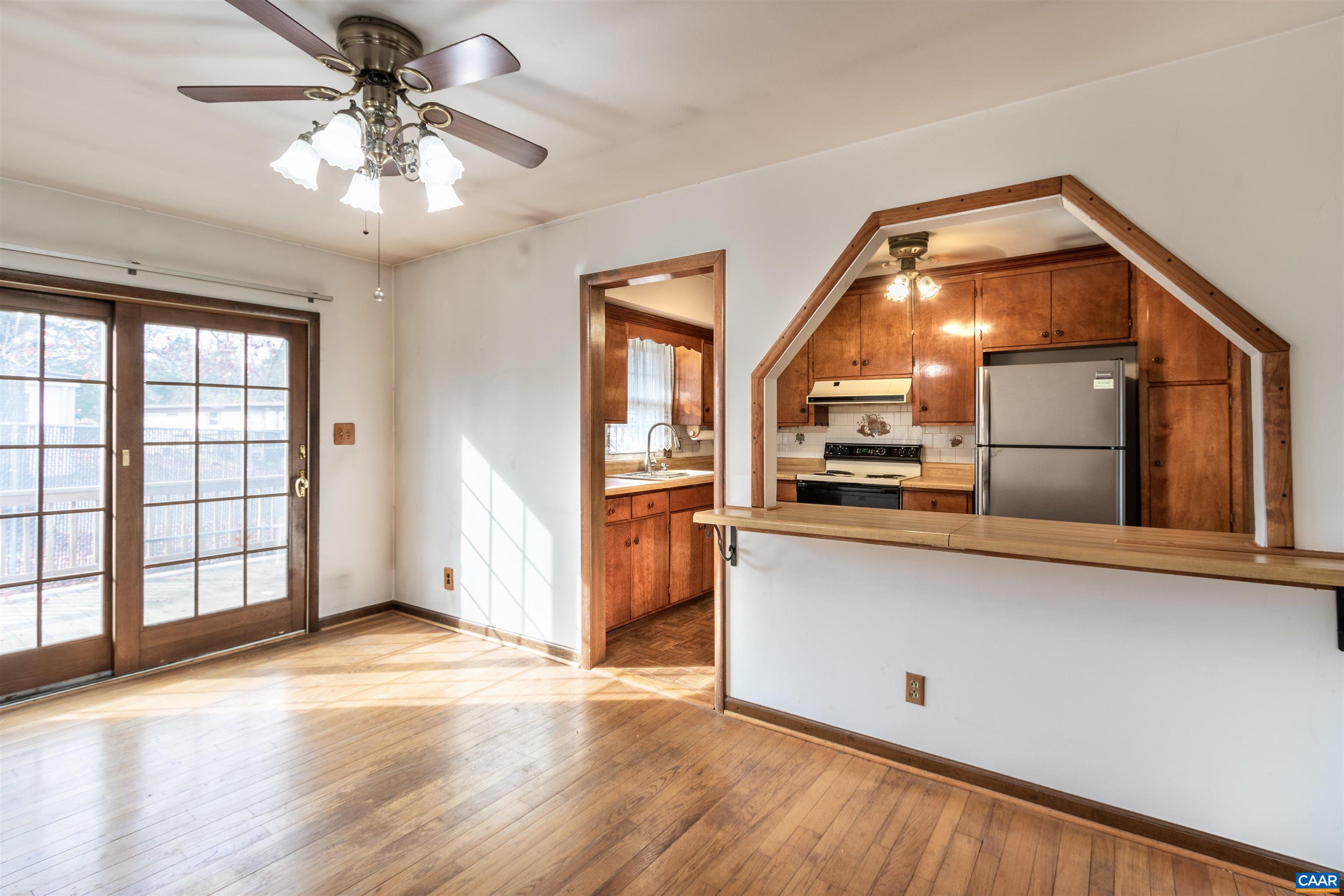 187 Warmar Road Ruckersville, VA 22968 - Photo 13 of 35 a view of a living room and kitchen with wooden floor