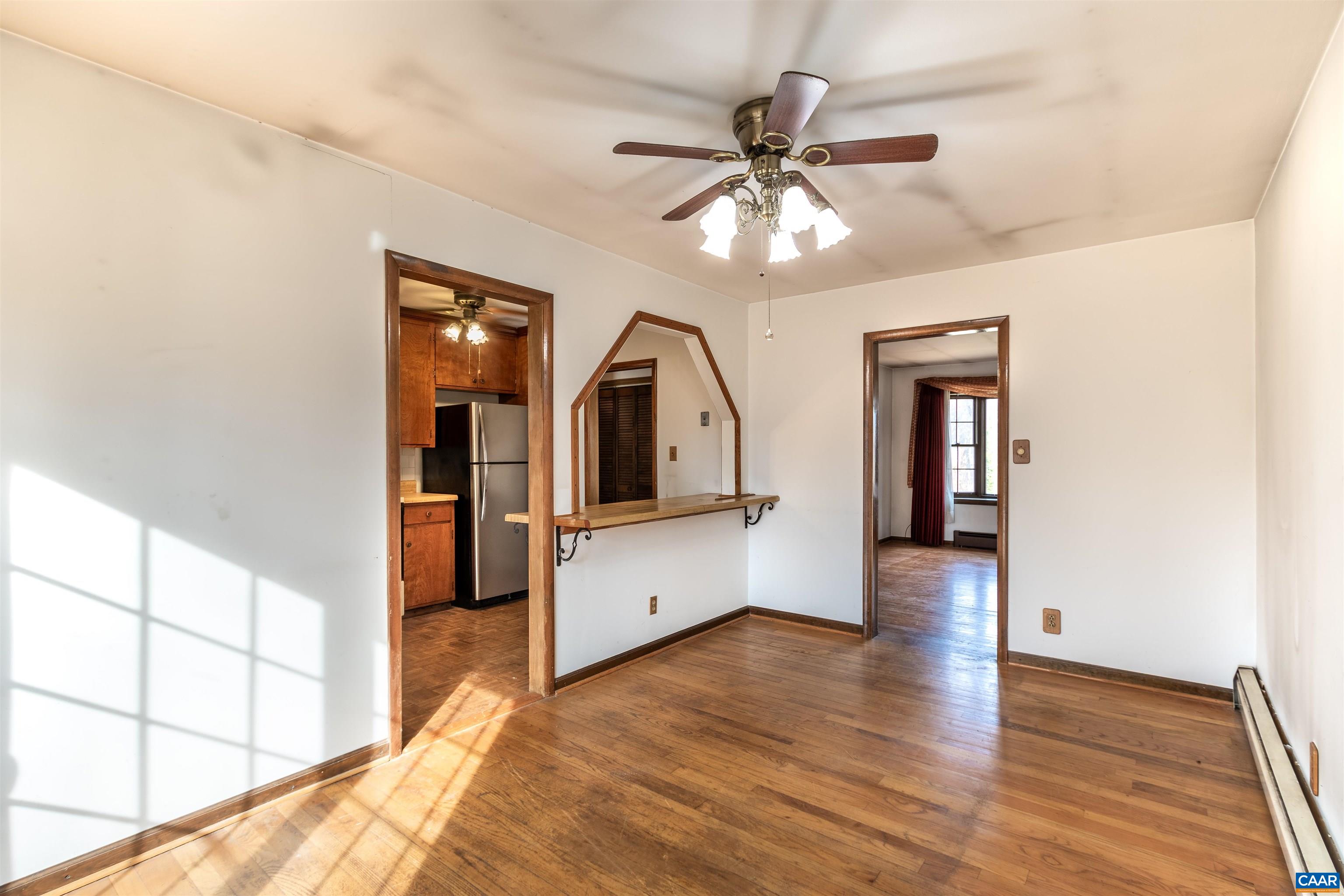 187 Warmar Road Ruckersville, VA 22968 - Photo 15 of 35 a view of a hallway with wooden floor and chandelier