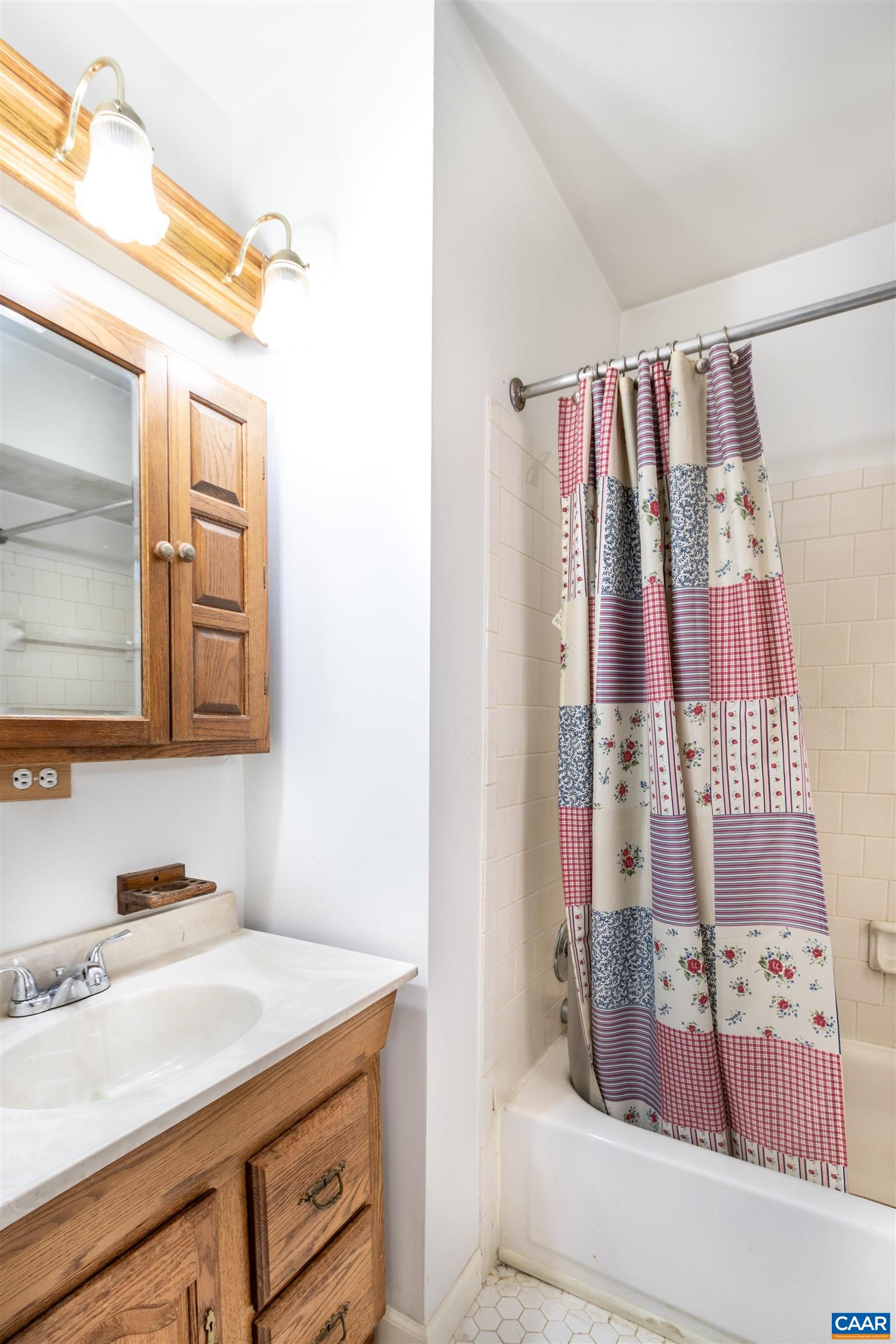 187 Warmar Road Ruckersville, VA 22968 - Photo 23 of 35 a bathroom with a sink and a mirror