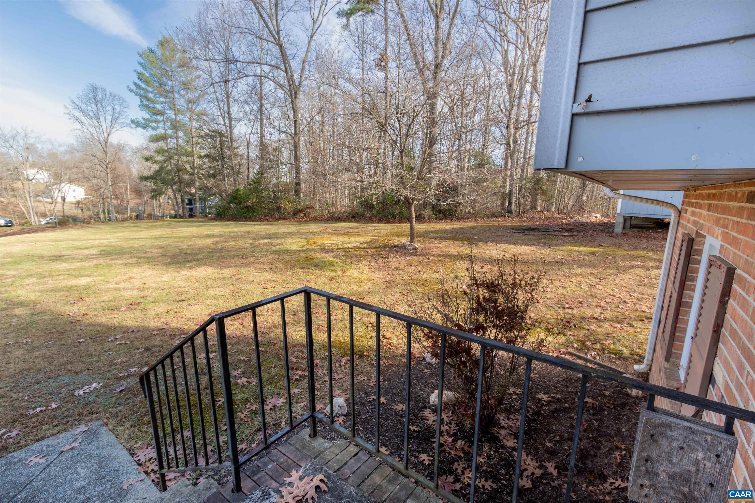 187 Warmar Road Ruckersville, VA 22968 - Photo 8 of 35 a view of a backyard with trees