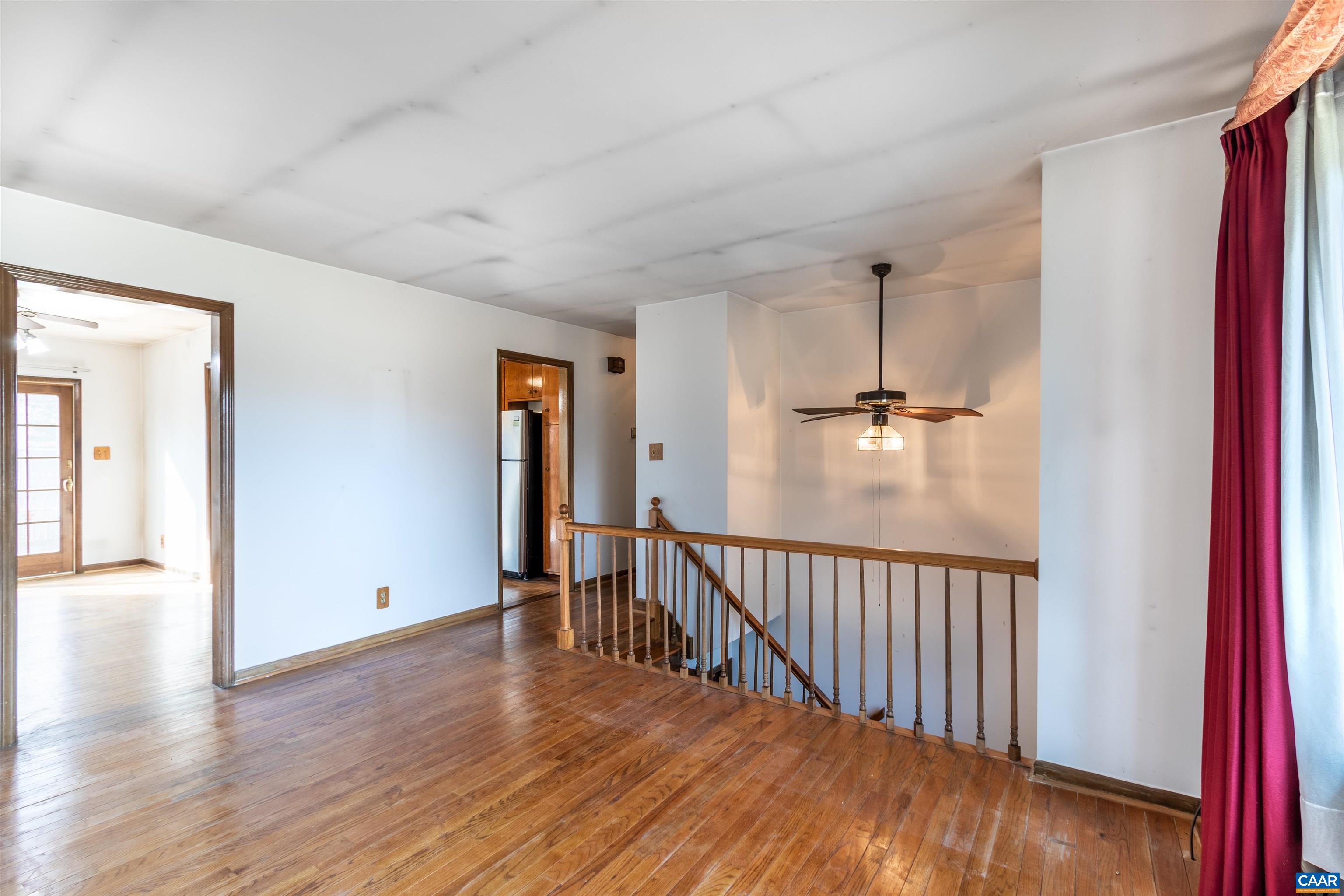 187 Warmar Road Ruckersville, VA 22968 - Photo 10 of 35 a view of a hallway with wooden floor and windows