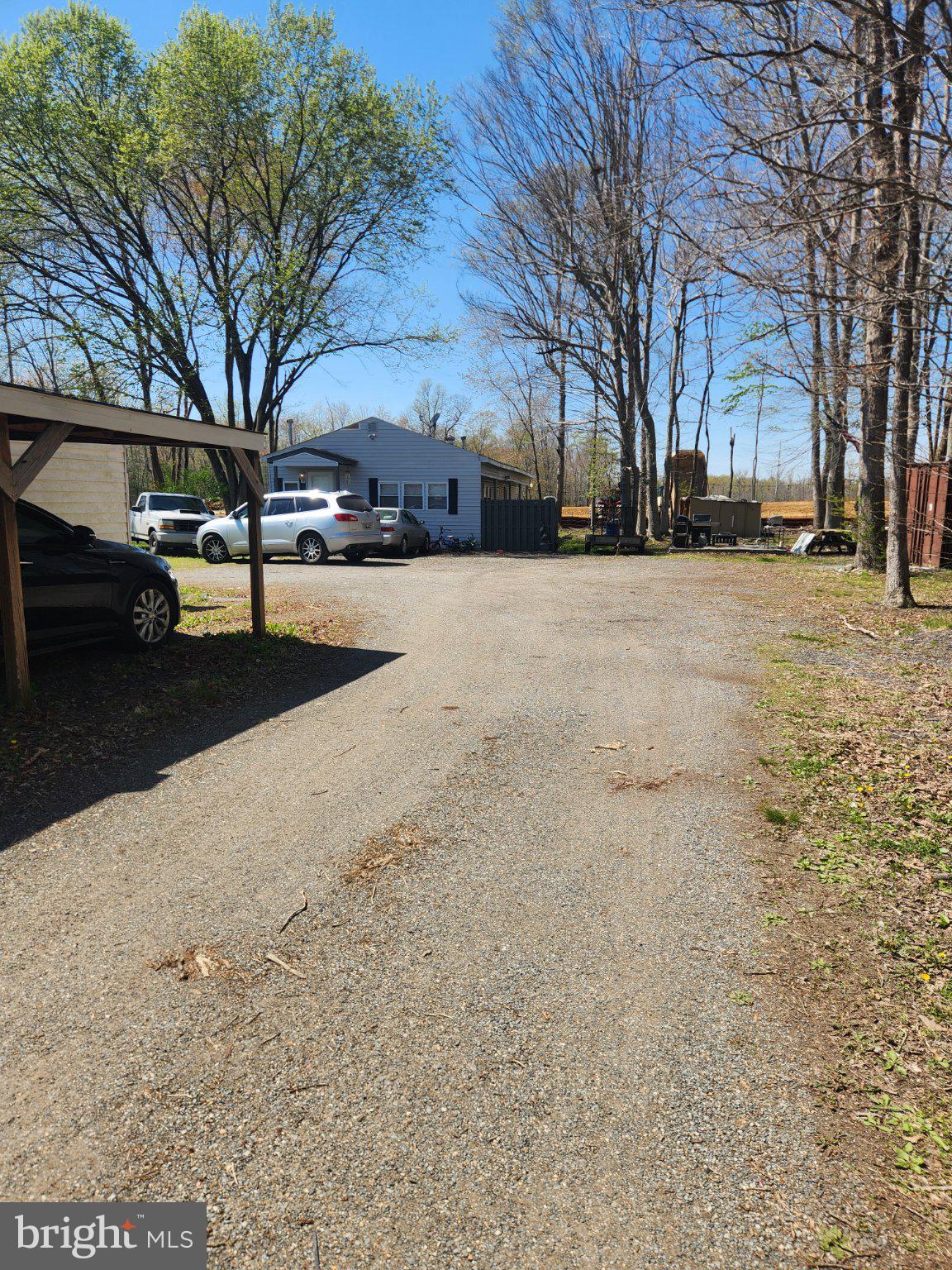 13621 Tower Road Brandywine, MD 20613 - Photo 6 of 10 Gravel driveway leading to the rear of the home