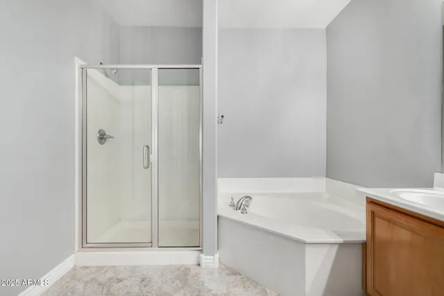 a bathroom with a bathtub and shower
