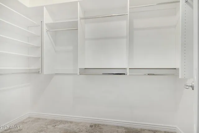 a view of an empty walk in closet