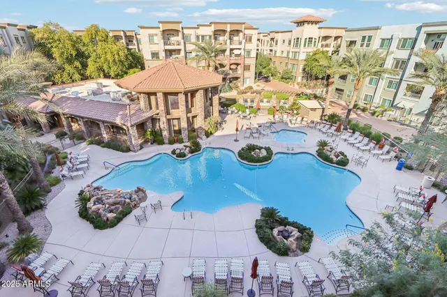 a front view of a building with a garden