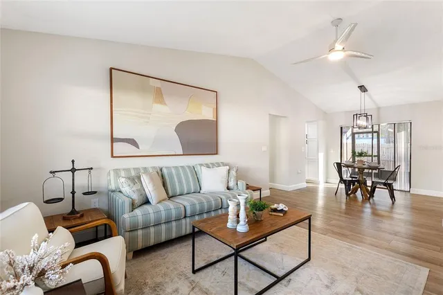 a living room with furniture and a table