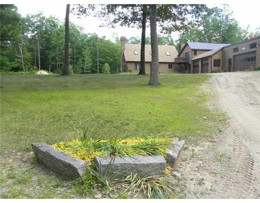 310 Lovewell Pond Road Fryeburg, ME 04037 - Photo 5 of 25 Exterior Front. Nice lawn with many...