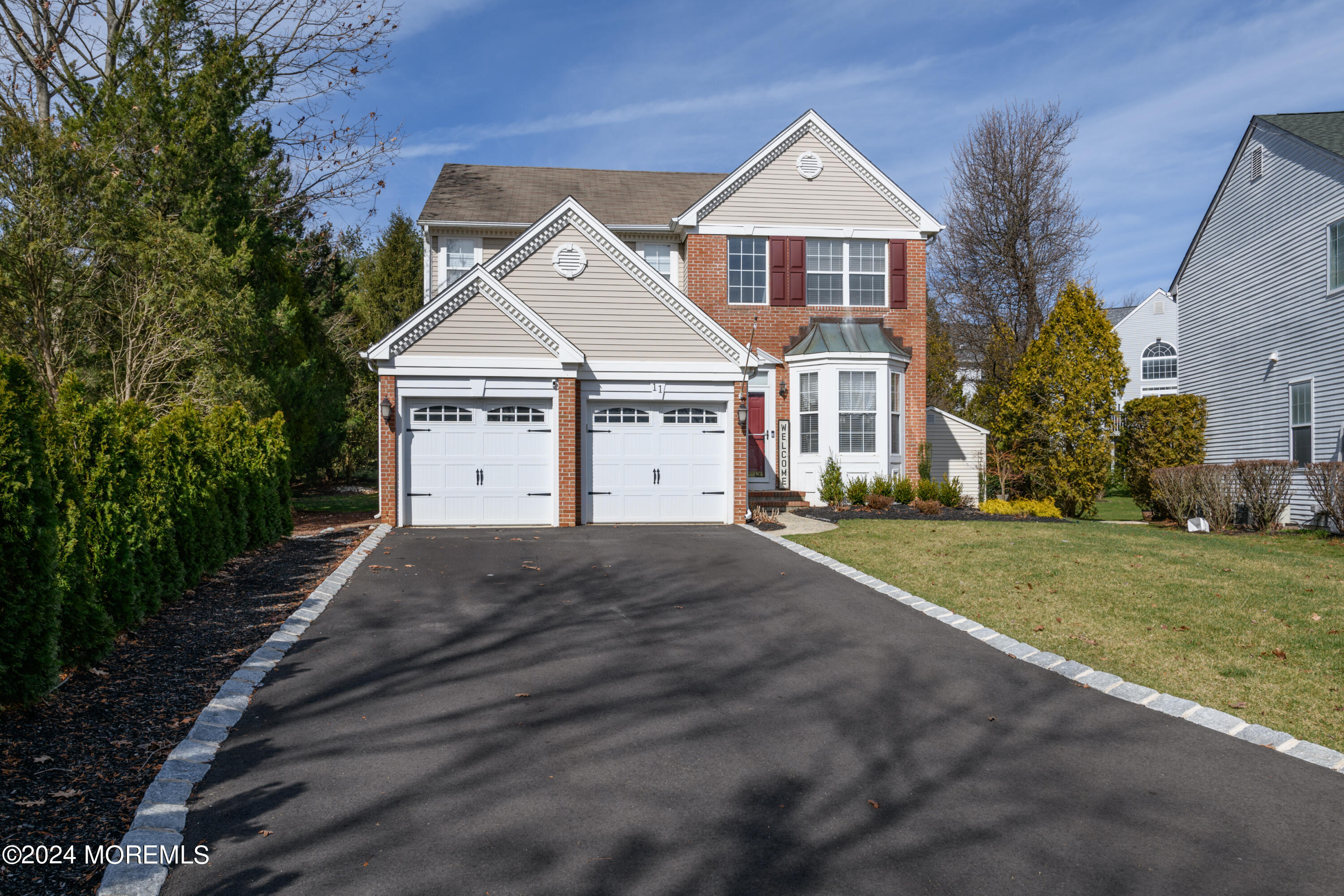 11 Exeter Pass Colts Neck, NJ 07722 - Photo 1 of 26 a front view of a house with a yard