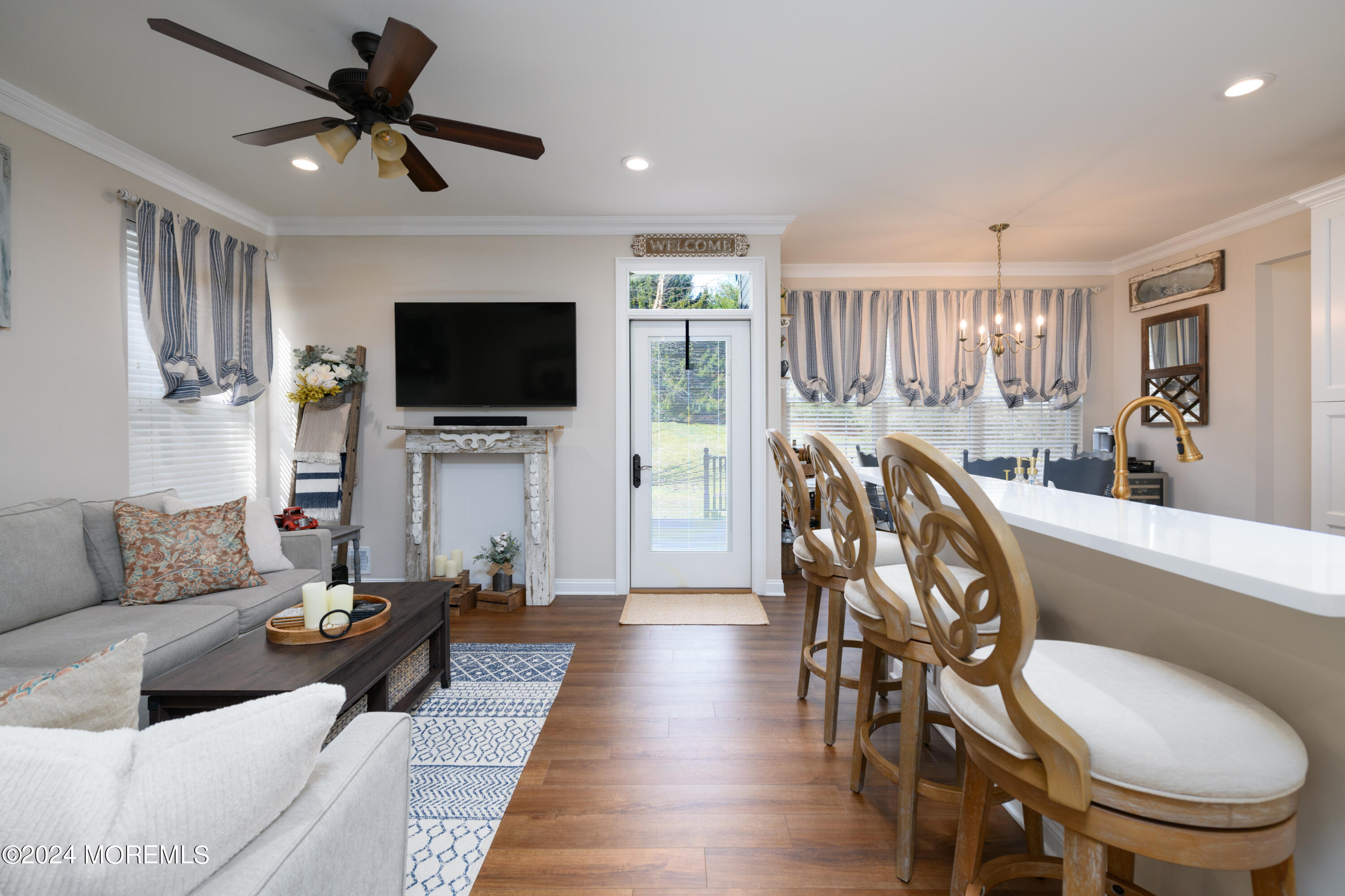 11 Exeter Pass Colts Neck, NJ 07722 - Photo 11 of 26 a living room with furniture and a flat screen tv
