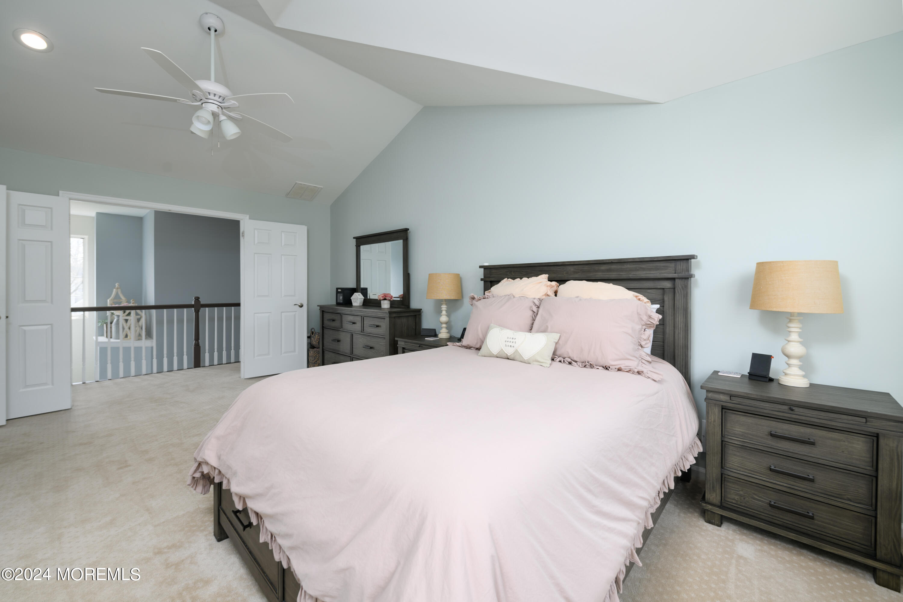 11 Exeter Pass Colts Neck, NJ 07722 - Photo 13 of 26 a bedroom with a bed and a lamp on dresser