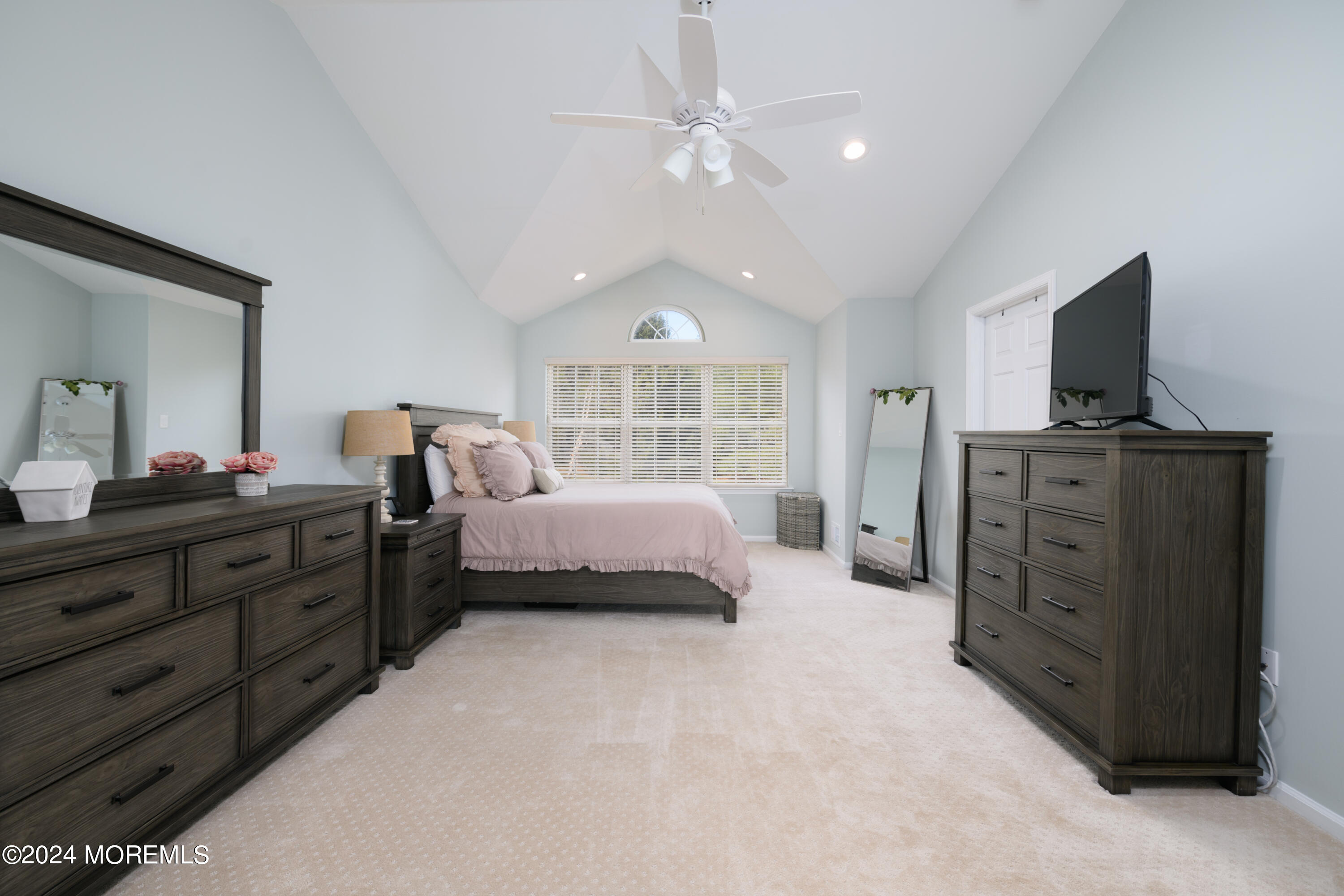 11 Exeter Pass Colts Neck, NJ 07722 - Photo 14 of 26 a spacious bedroom with a bed and a flat screen tv