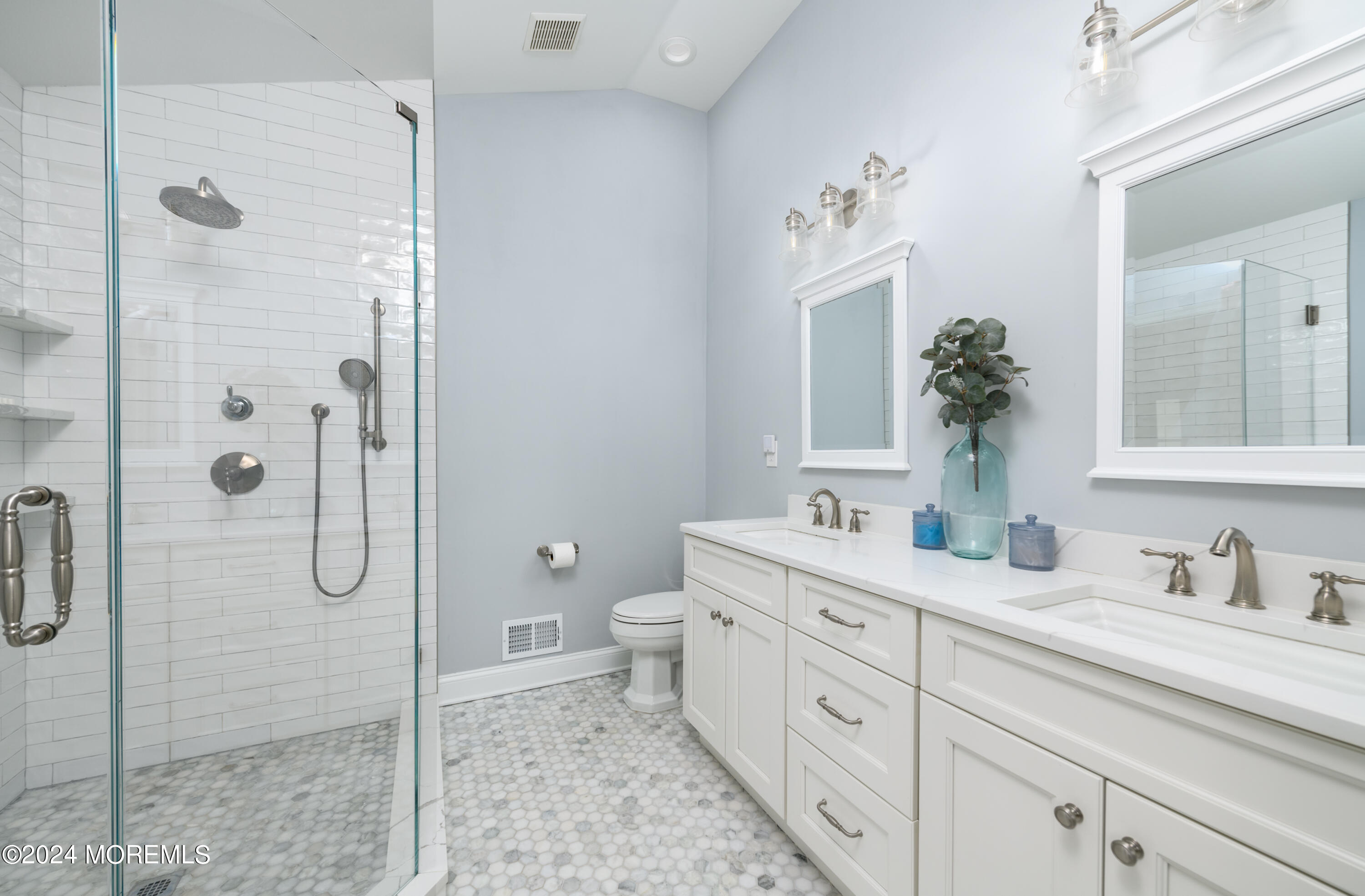 11 Exeter Pass Colts Neck, NJ 07722 - Photo 17 of 26 a spacious bathroom with a double vanity sink toilet and shower