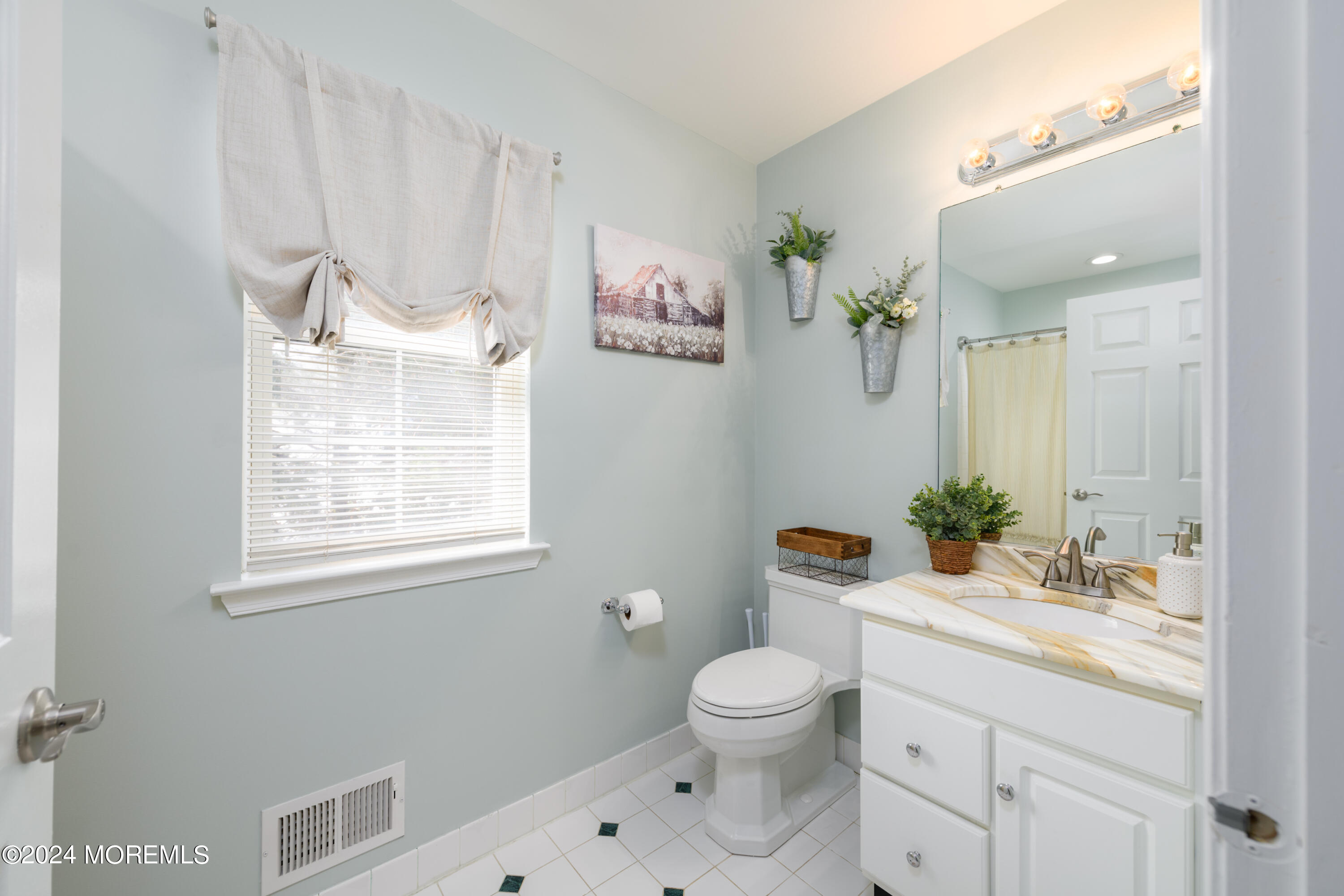 11 Exeter Pass Colts Neck, NJ 07722 - Photo 21 of 26 a bathroom with a granite countertop sink a toilet and a mirror