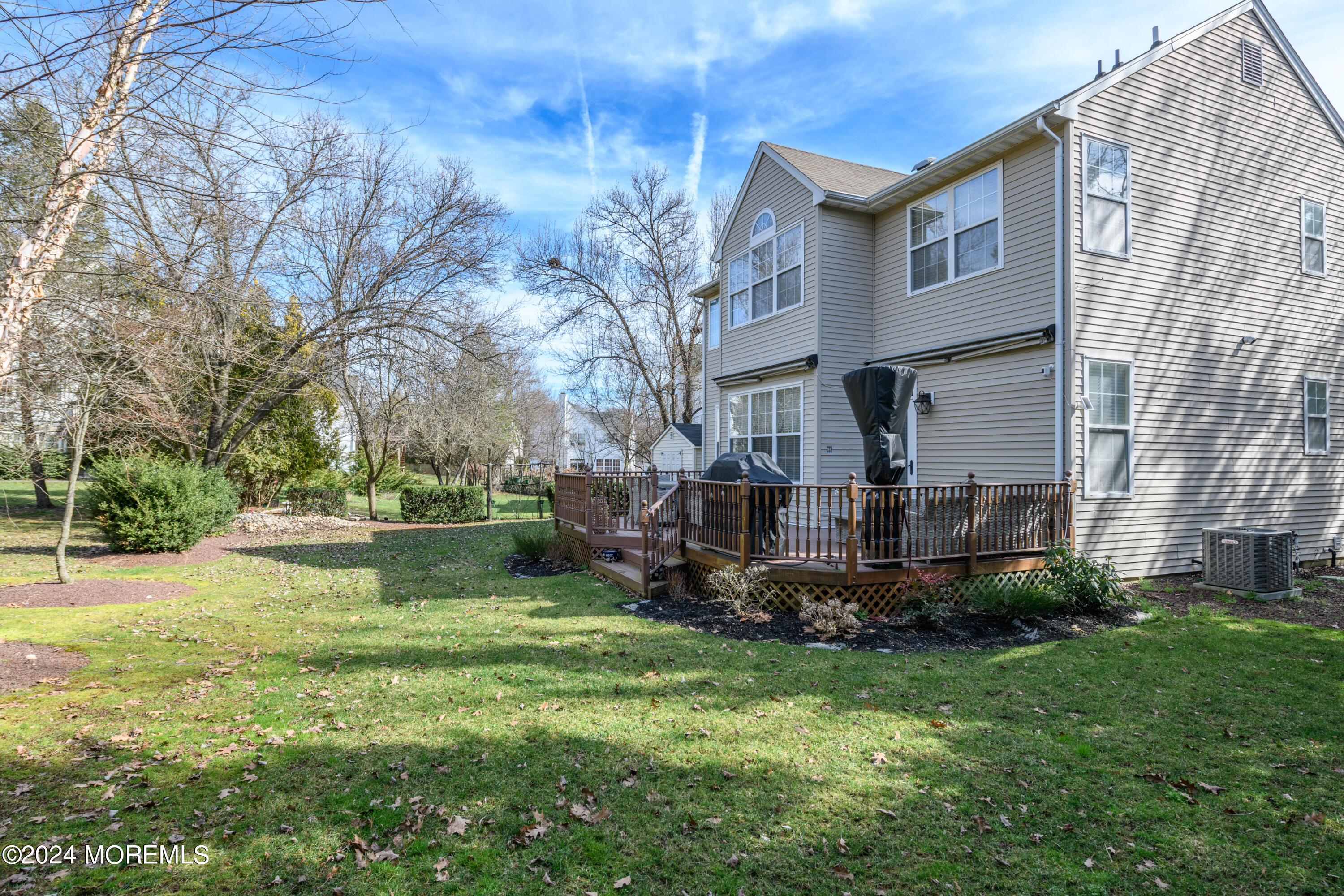 11 Exeter Pass Colts Neck, NJ 07722 - Photo 24 of 26 a view of a garden with a fountain