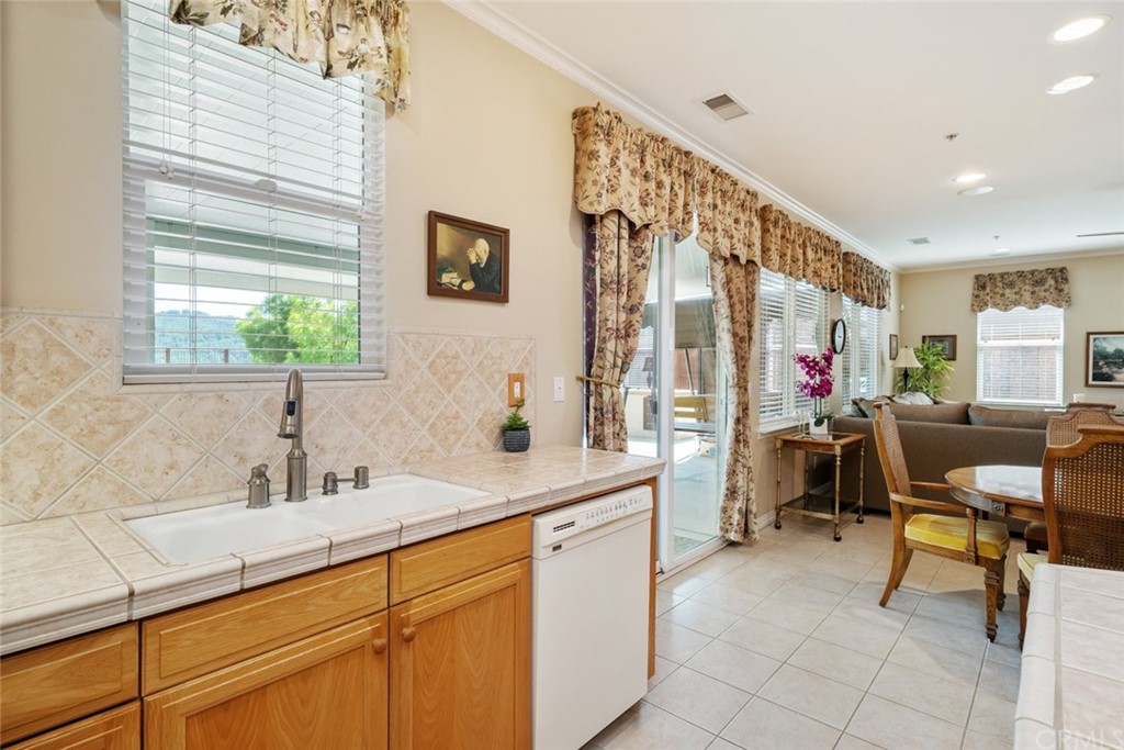 1675 Via Rojas Templeton, CA 93465 - Photo 13 of 60 a kitchen with sink cabinets and outdoor view