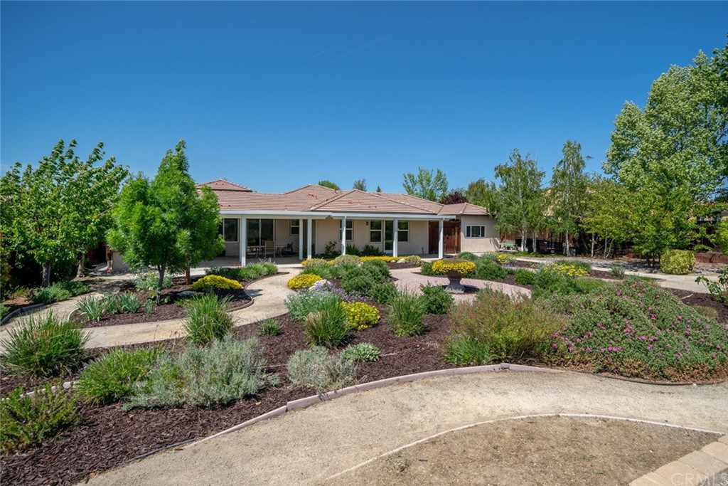 1675 Via Rojas Templeton, CA 93465 - Photo 20 of 60 a front view of house with a garden