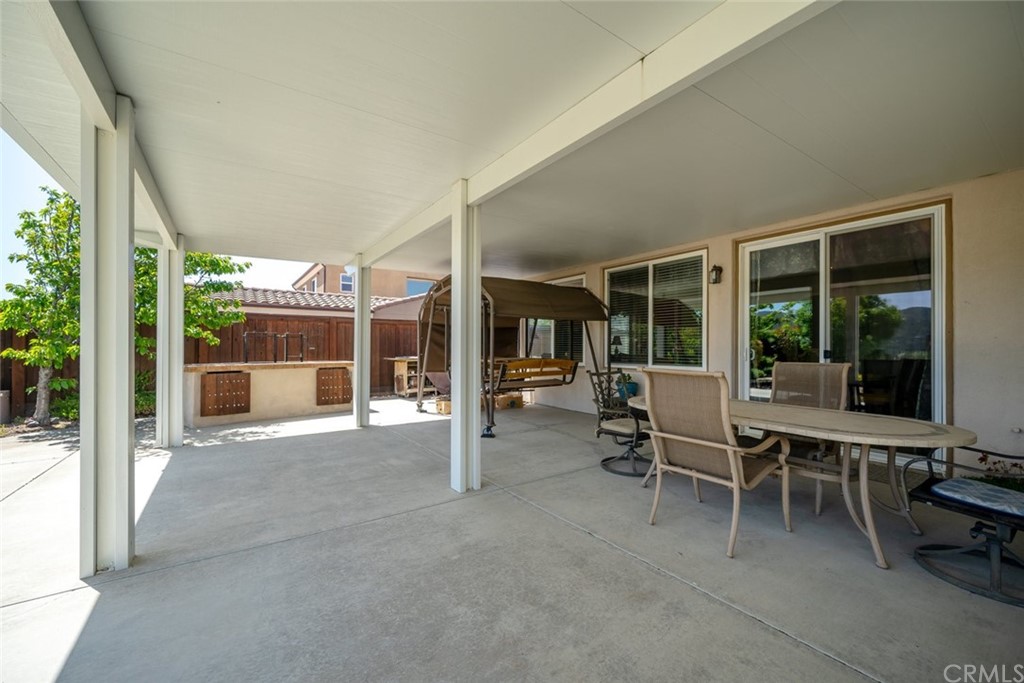 1675 Via Rojas Templeton, CA 93465 - Photo 21 of 60 a view of a patio with table and chairs next to a yard