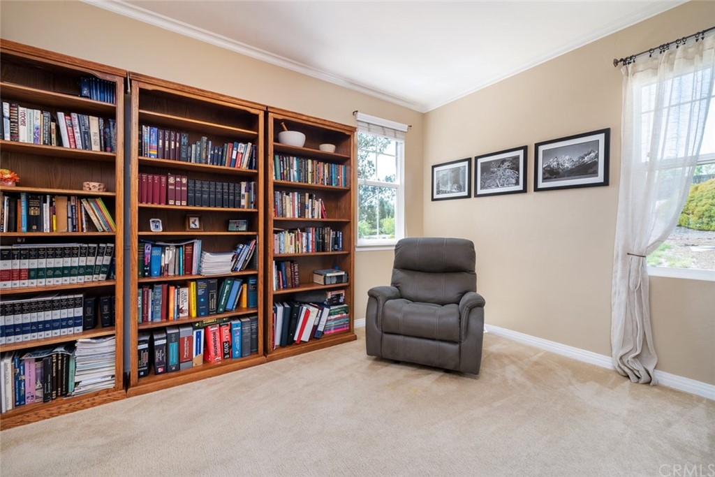 1675 Via Rojas Templeton, CA 93465 - Photo 25 of 60 a living room with a book shelf and a book shelf