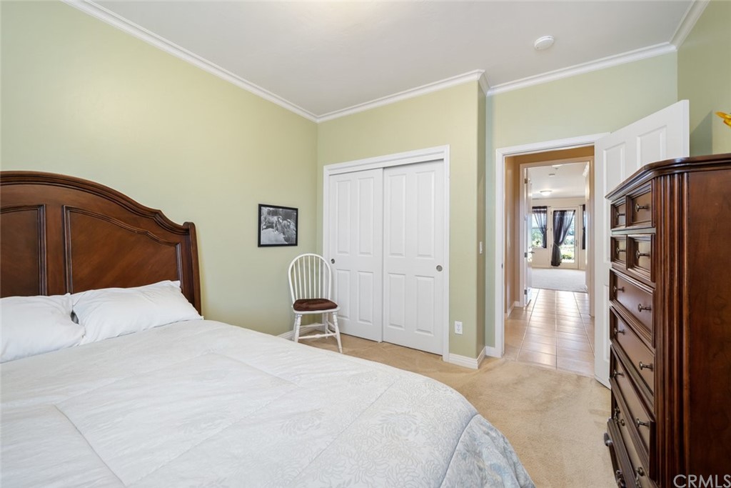 1675 Via Rojas Templeton, CA 93465 - Photo 35 of 60 a bedroom with a large bed and a closet