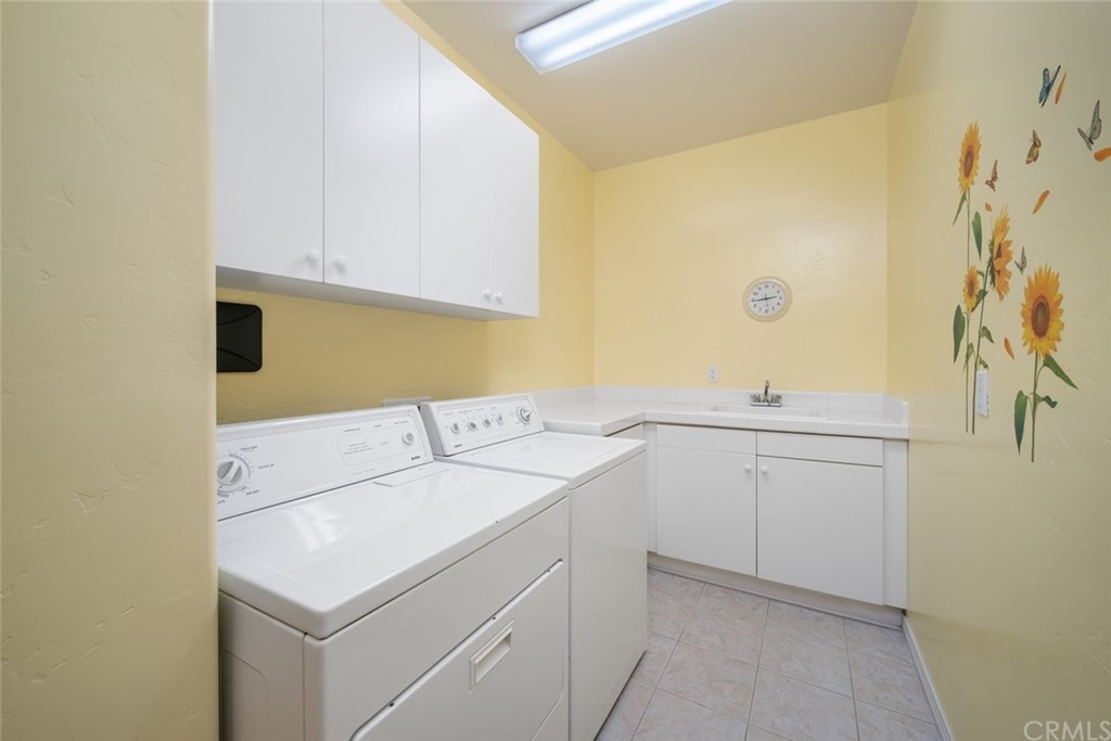 1675 Via Rojas Templeton, CA 93465 - Photo 41 of 60 a utility room with cabinets washer and dryer
