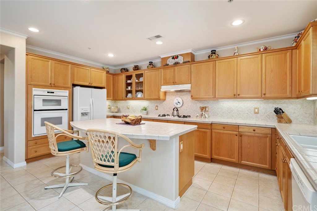 1675 Via Rojas Templeton, CA 93465 - Photo 9 of 60 a kitchen with stainless steel appliances granite countertop a sink and cabinets