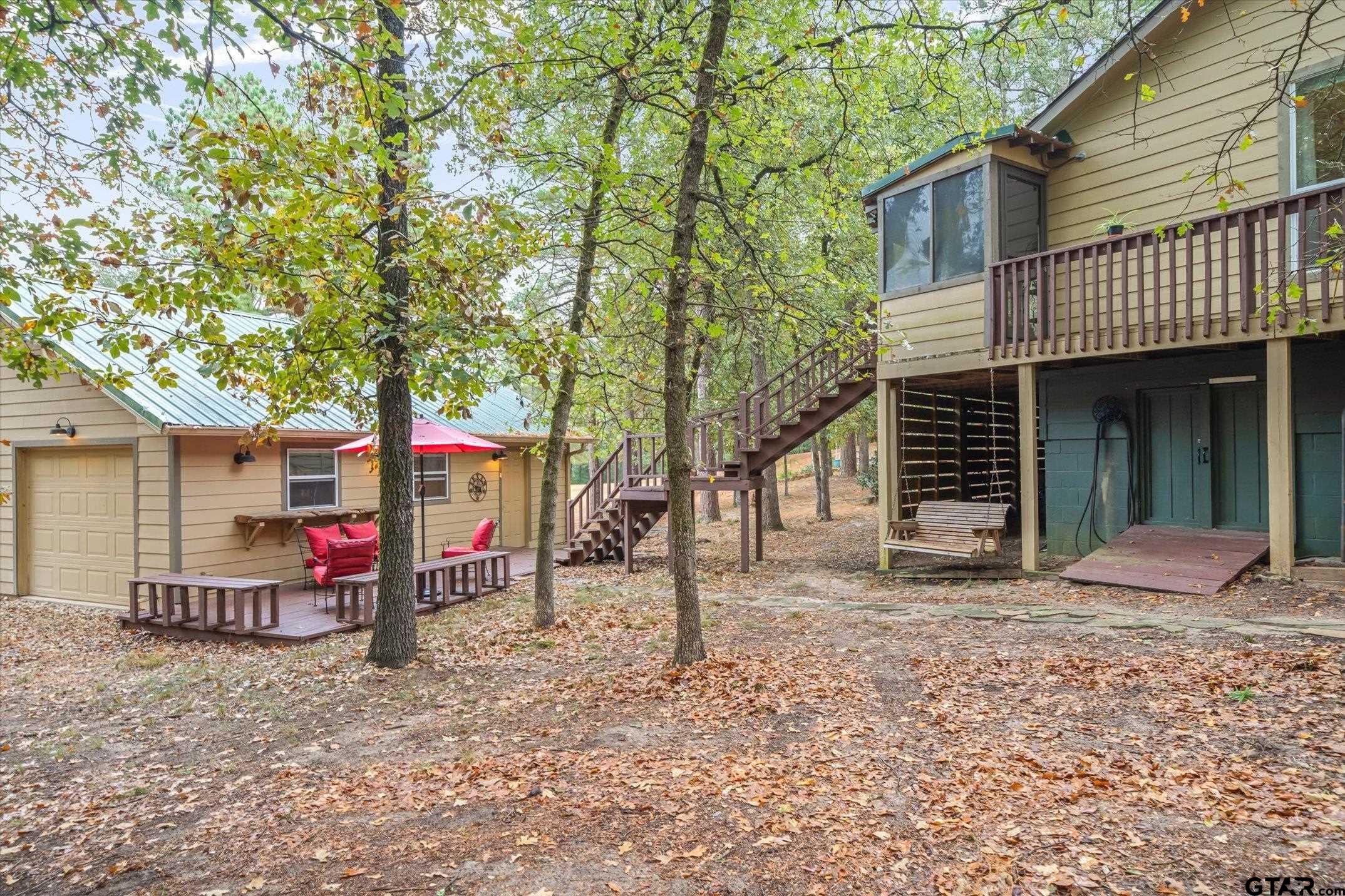 150 Green Oak Holly Lake Ranch, TX 75765 - Photo 5 of 48 Back of house. Tons of storage in this area!