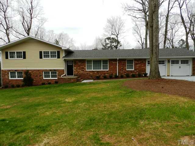 5308 Fairoaks Road Durham, NC 27712 - Photo 1 of 4 a front view of house with yard and green space