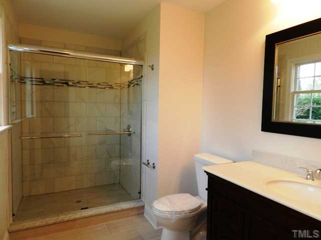 5308 Fairoaks Road Durham, NC 27712 - Photo 4 of 4 a bathroom with a shower a toilet and sink
