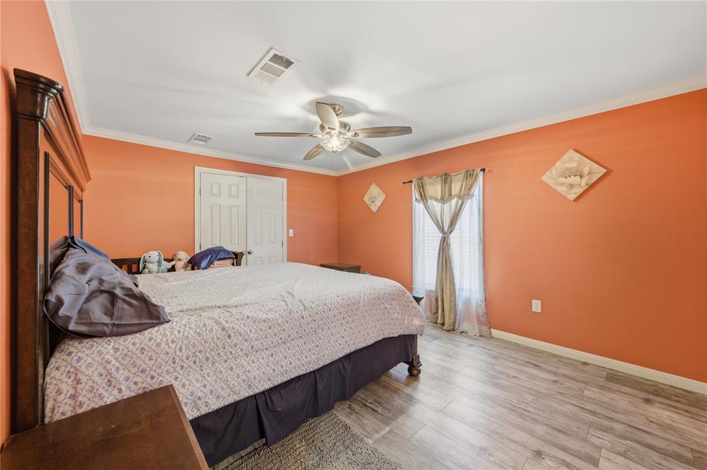 3624 Redbird Street Bellmead, TX 76705 - Photo 11 of 20 a bed room with a bed and a ceiling fan