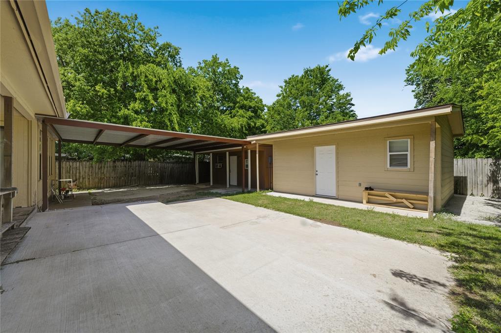 3624 Redbird Street Bellmead, TX 76705 - Photo 19 of 20 a backyard of a house with large trees and a small yard