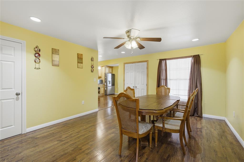 3624 Redbird Street Bellmead, TX 76705 - Photo 9 of 20 a view of a dining room with furniture and wooden floor