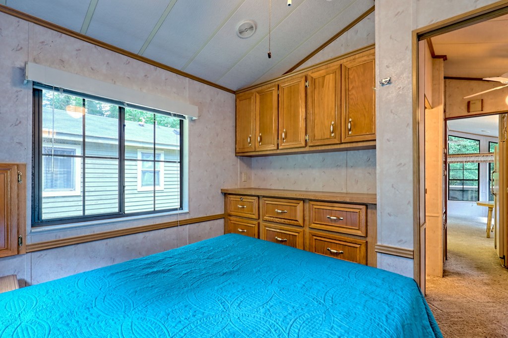 641 Cold Branch Road Hayesville, NC 28904 - Photo 17 of 65 a bedroom with a bed and wooden floor