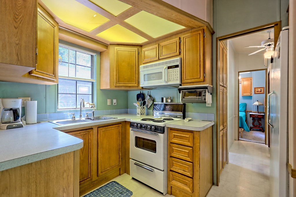 641 Cold Branch Road Hayesville, NC 28904 - Photo 40 of 65 a kitchen with stainless steel appliances granite countertop a sink and cabinets