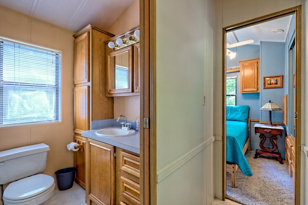 641 Cold Branch Road Hayesville, NC 28904 - Photo 44 of 65 a bathroom with a sink toilet and mirror