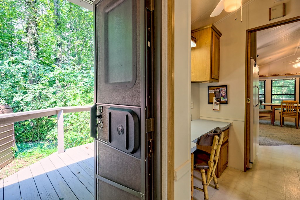 641 Cold Branch Road Hayesville, NC 28904 - Photo 48 of 65 a view of a balcony with furniture and floor to ceiling window